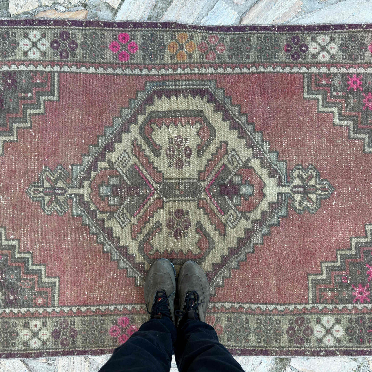 1970s pink vintage turkish rug with traditional design, hand-knotted weave and low pile.