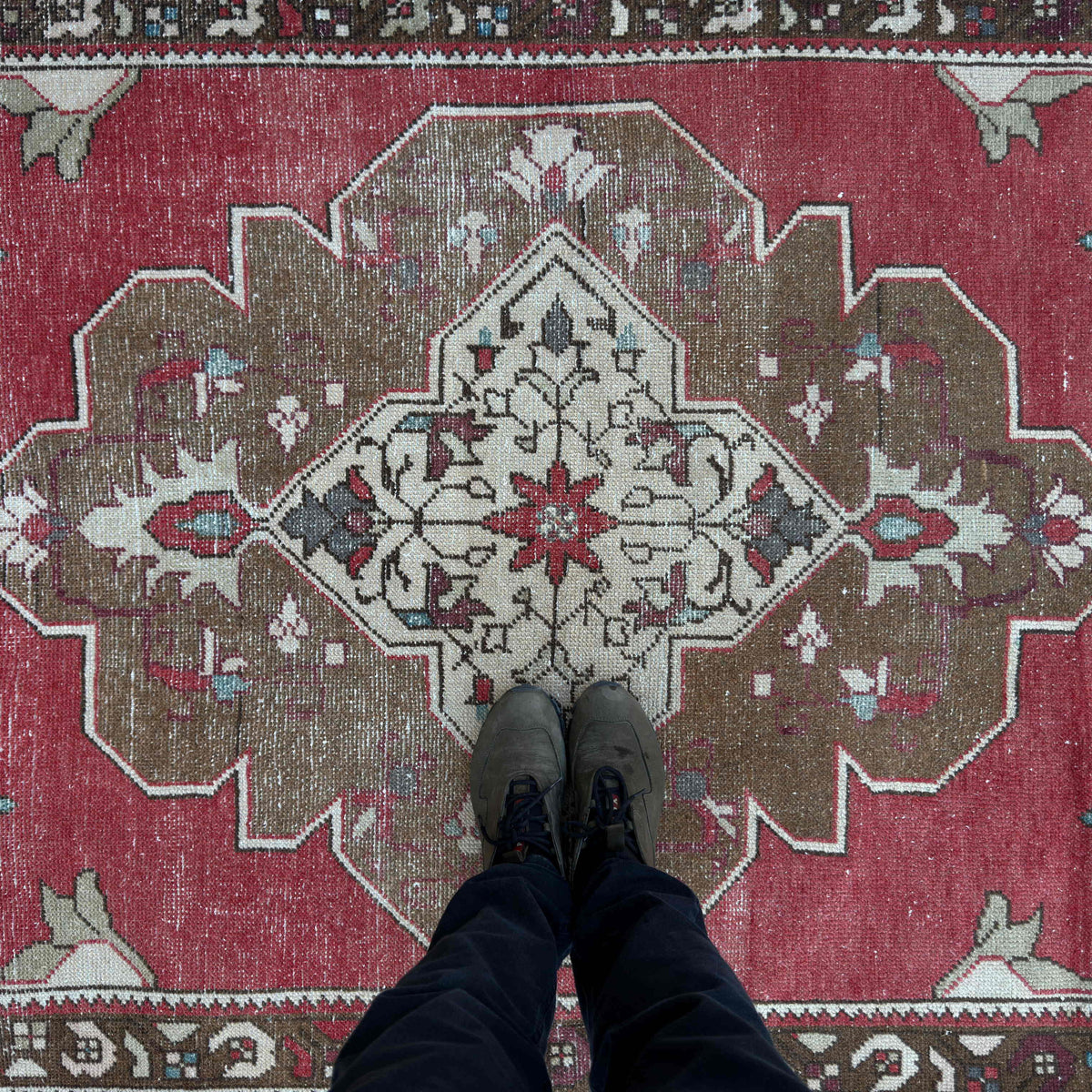 1970s red vintage turkish rug with medallion design, hand-knotted weave and low pile.