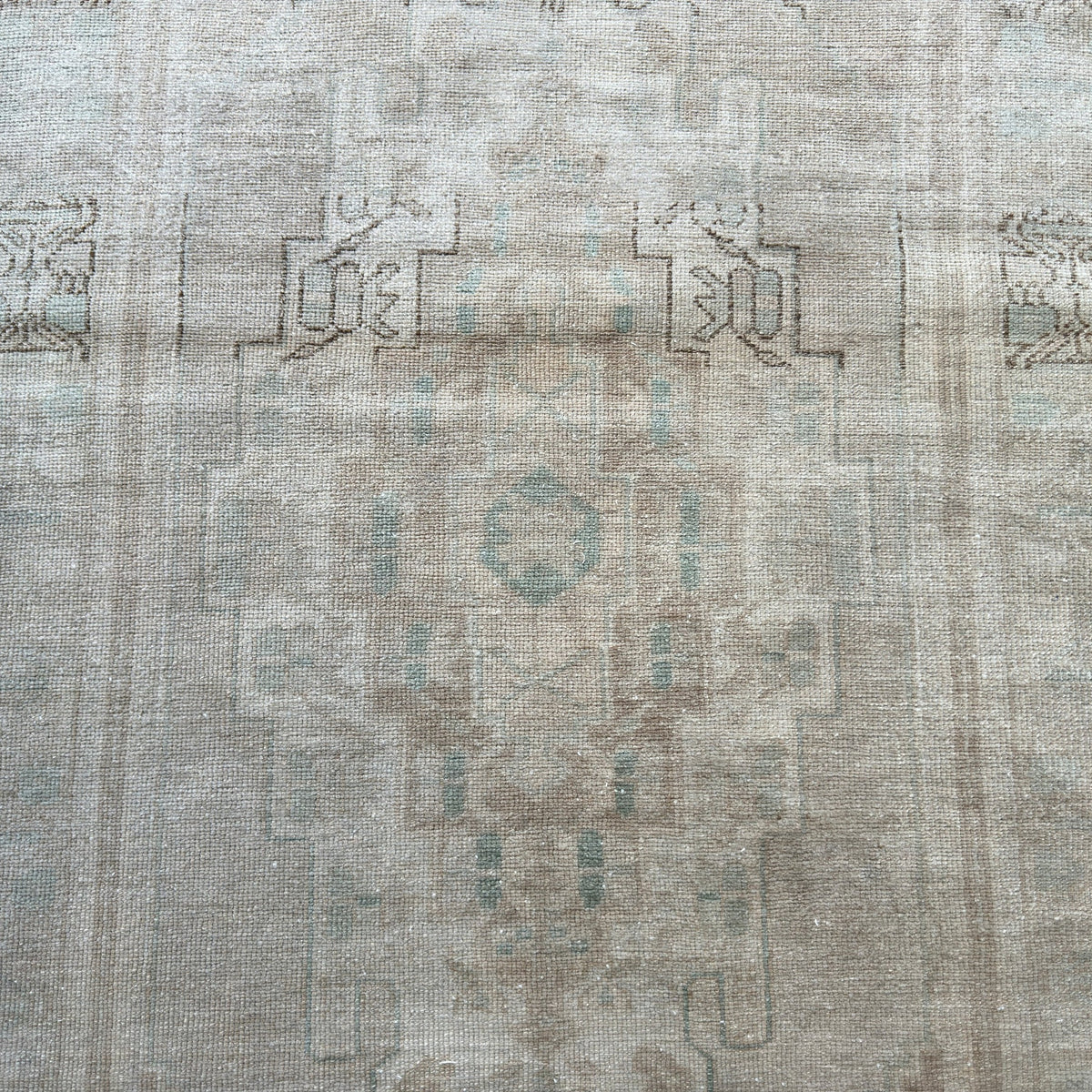 1970s beige vintage turkish rug with neutral design, hand-knotted weave and low pile.