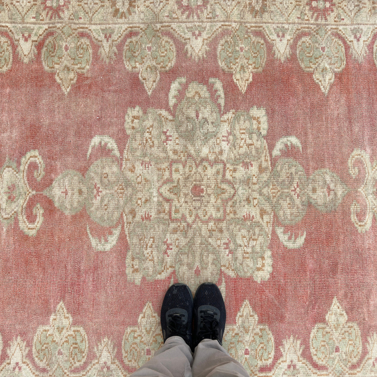 1970s red vintage turkish rug with traditional design, hand-knotted weave and low pile.