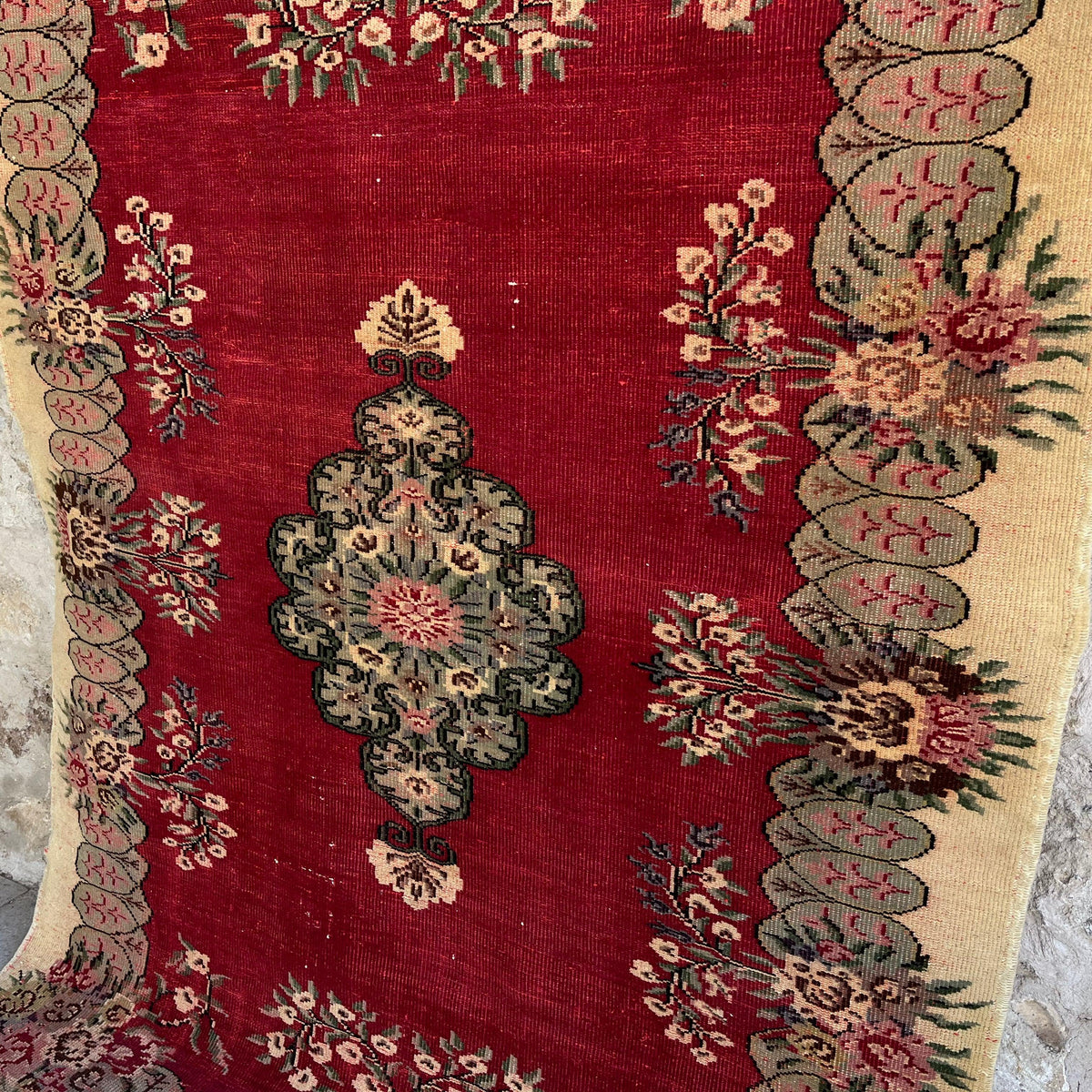 1970s red vintage turkish rug with traditional design, hand-knotted weave and low pile.