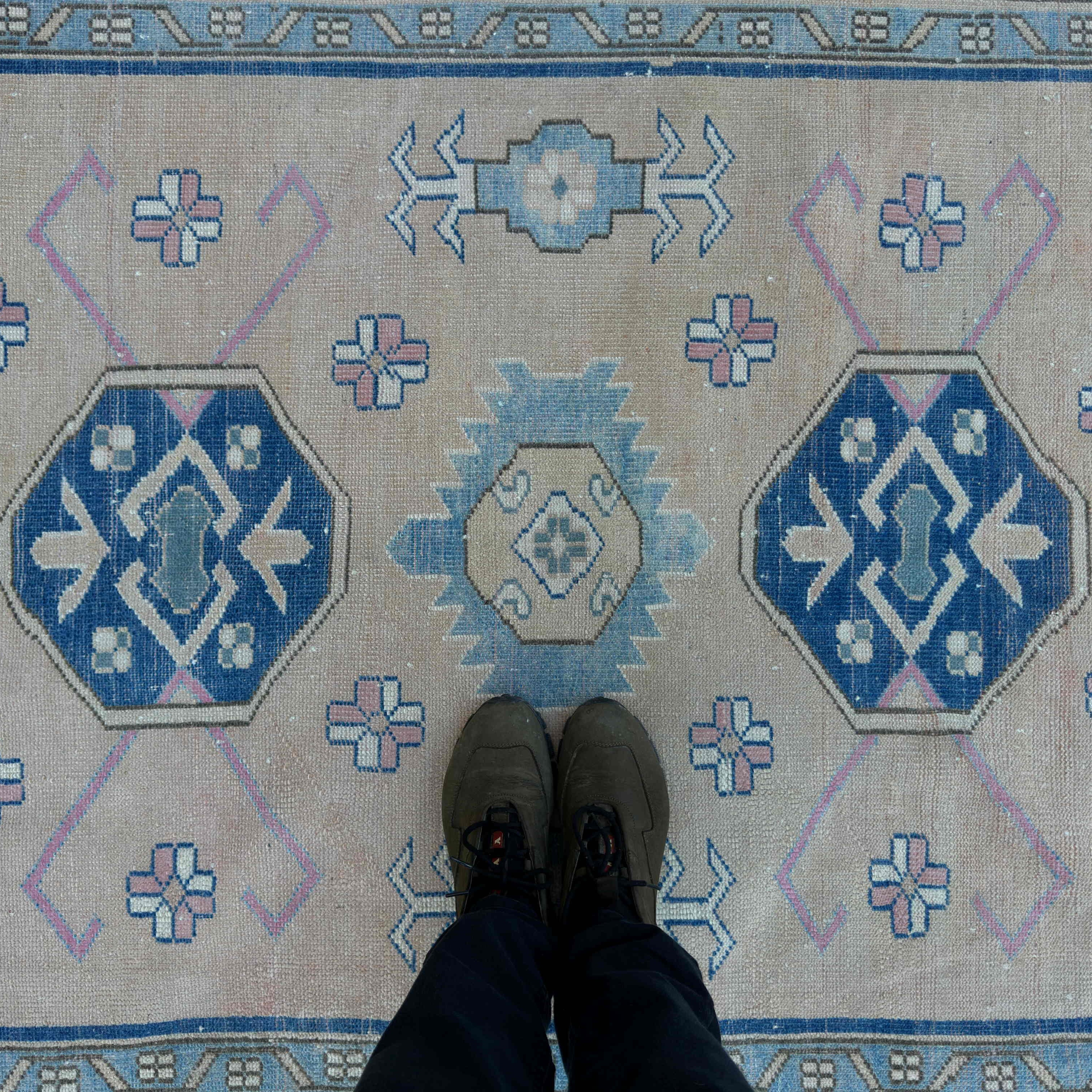 1970s blue vintage turkish rug with traditional design, hand-knotted weave and low pile.