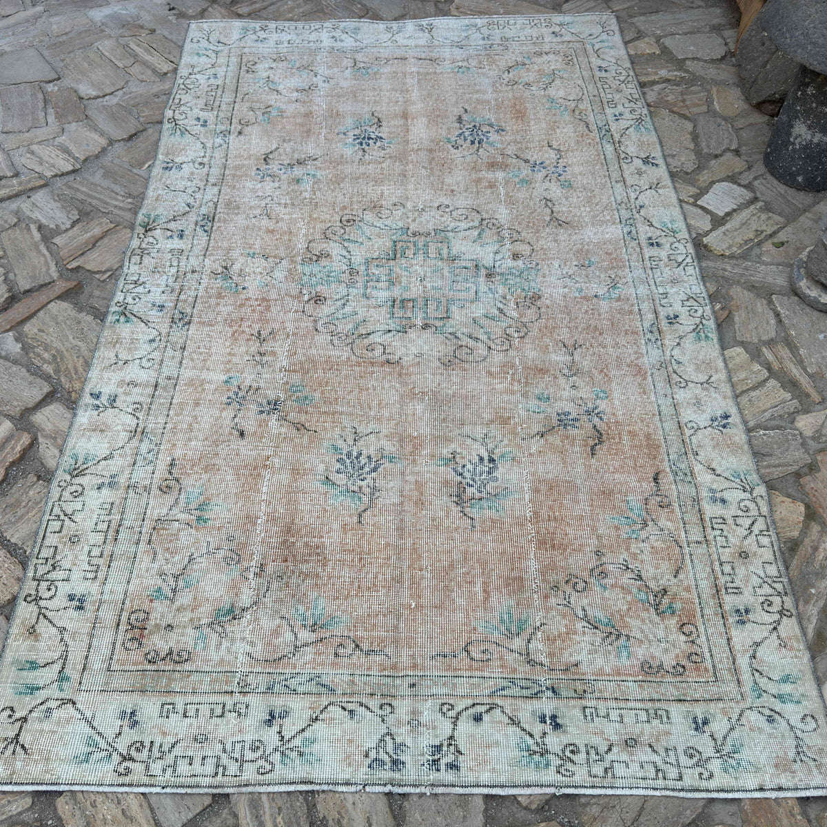 Orange 5' x 8' vintage turkish rug in wool and cotton, shown on the floor.