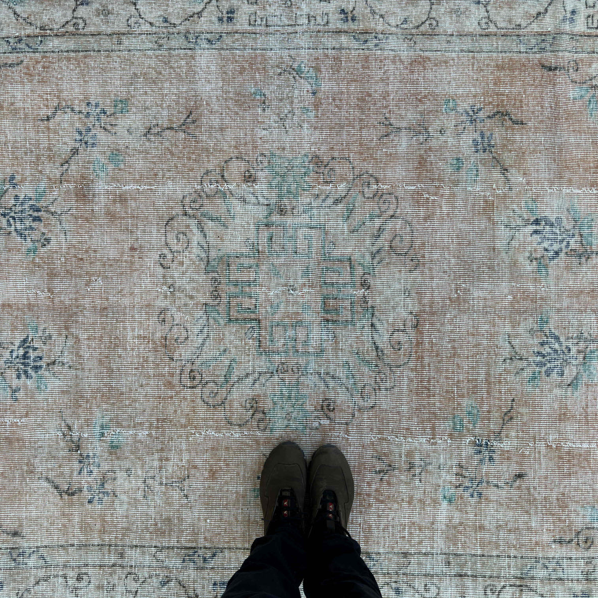 1970s orange vintage turkish rug with medallion design, hand-knotted weave and low pile.