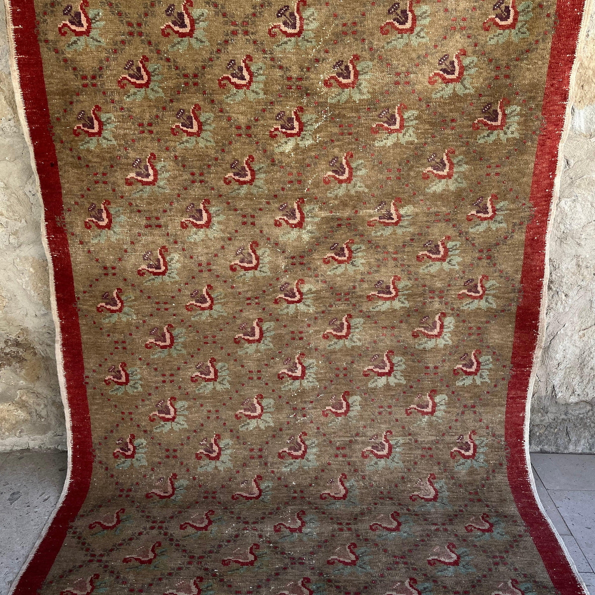 Brown 5' x 9' vintage turkish rug in wool and cotton, shown on the floor.