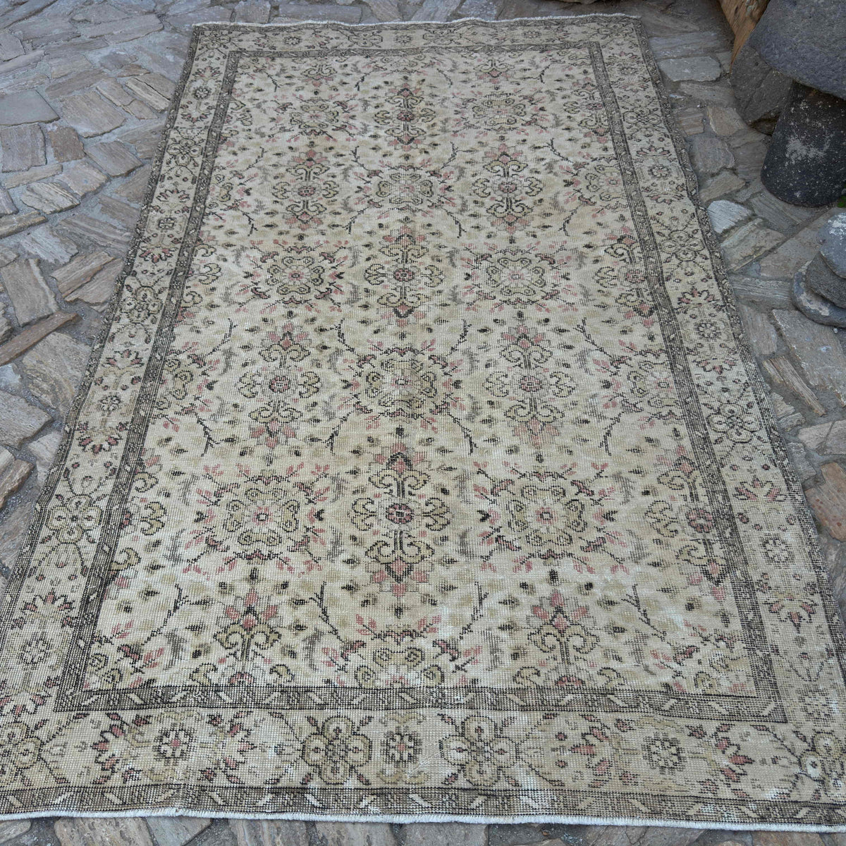 Brown 5' x 9' vintage turkish rug in wool and cotton, shown on the floor.