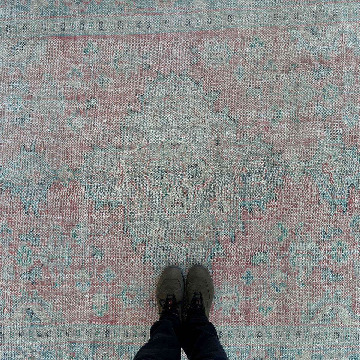 1970s red vintage turkish rug with medallion design, hand-knotted weave and low pile.
