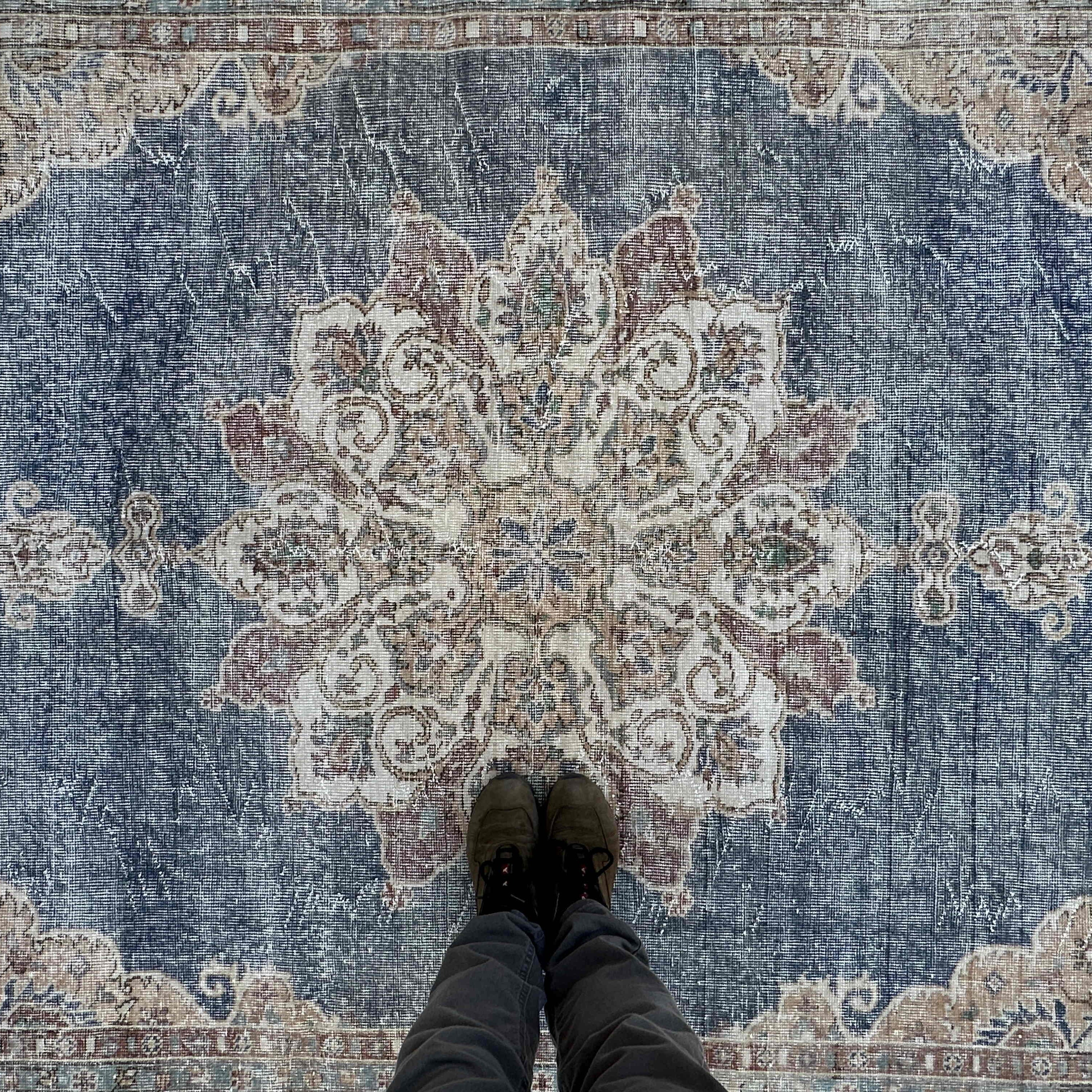 1970s blue vintage turkish rug with medallion design, hand-knotted weave and low pile.