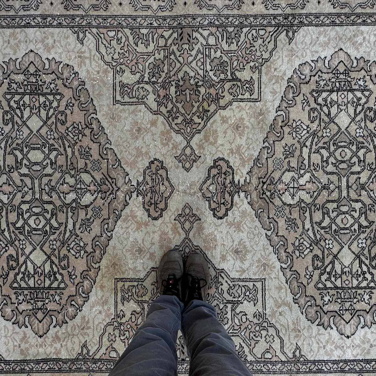 1970s brown vintage turkish rug with traditional design, hand-knotted weave and low pile.