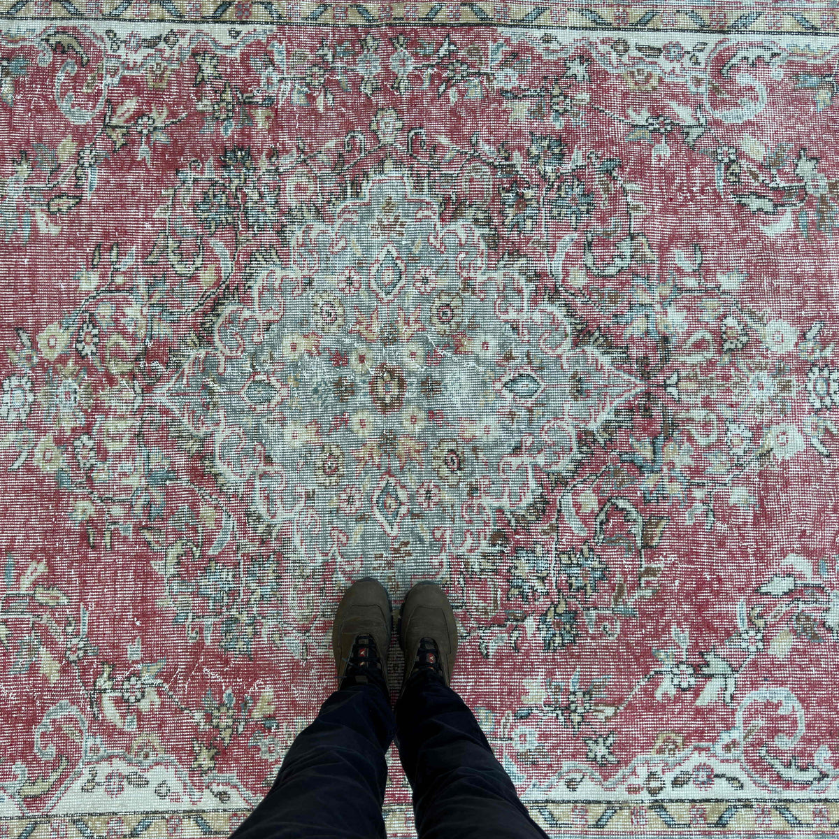 1970s red vintage turkish rug with medallion design, hand-knotted weave and low pile.