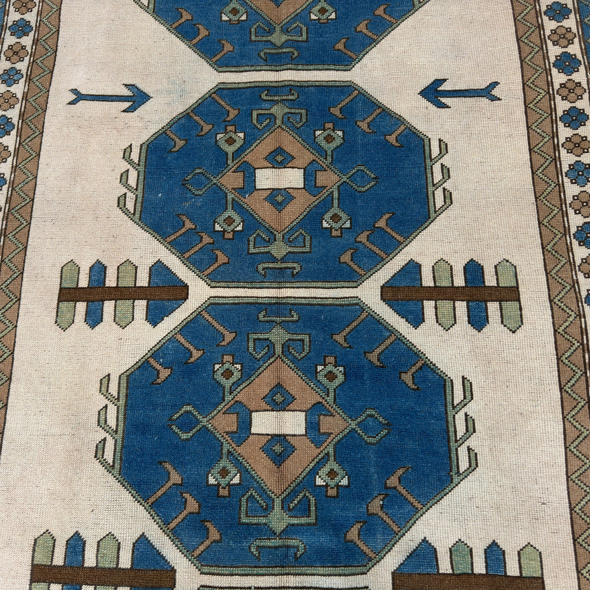 1970s blue vintage turkish rug with traditional design, hand-knotted weave and low pile.