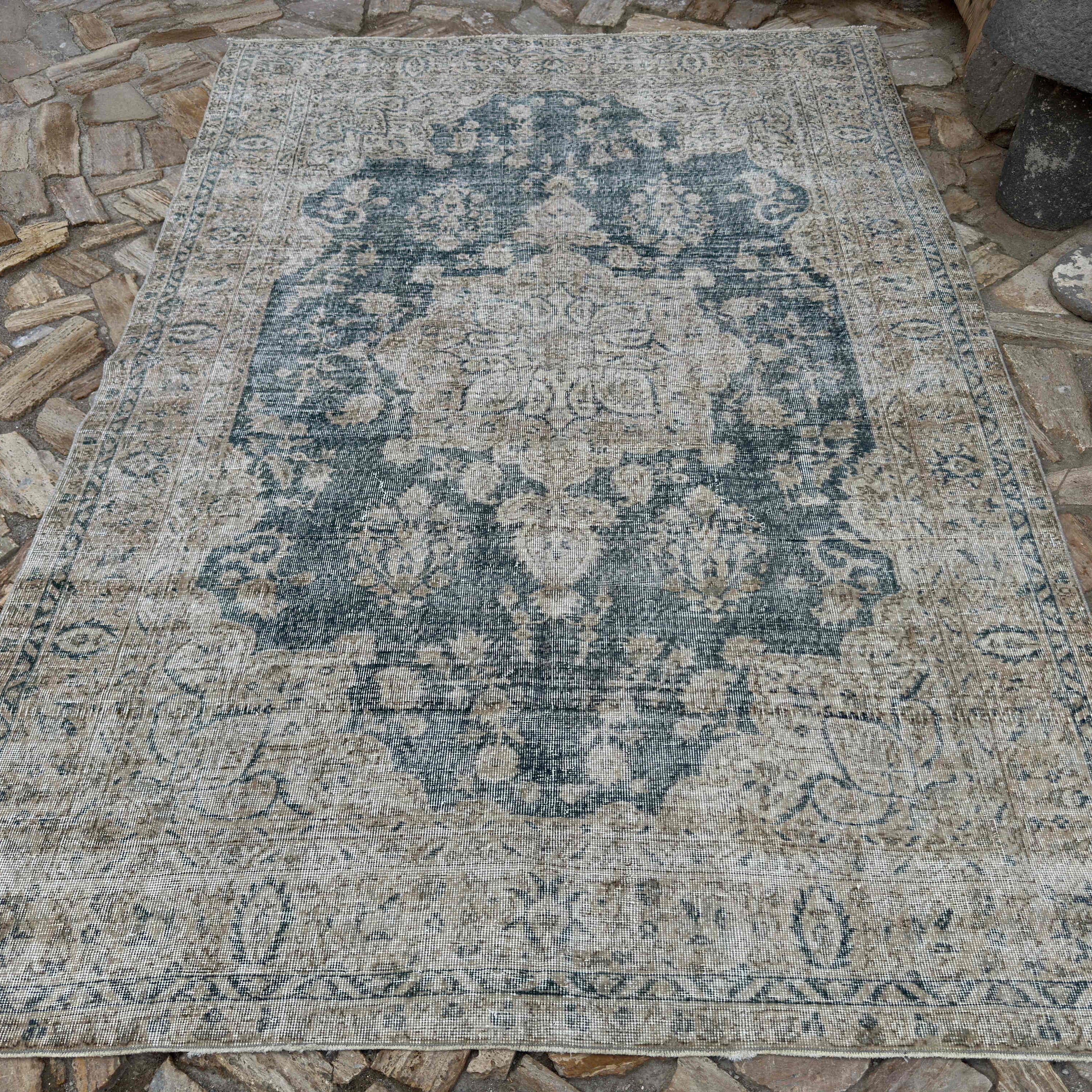 Blue 6' x 9' vintage turkish rug in wool and cotton, shown on the floor.
