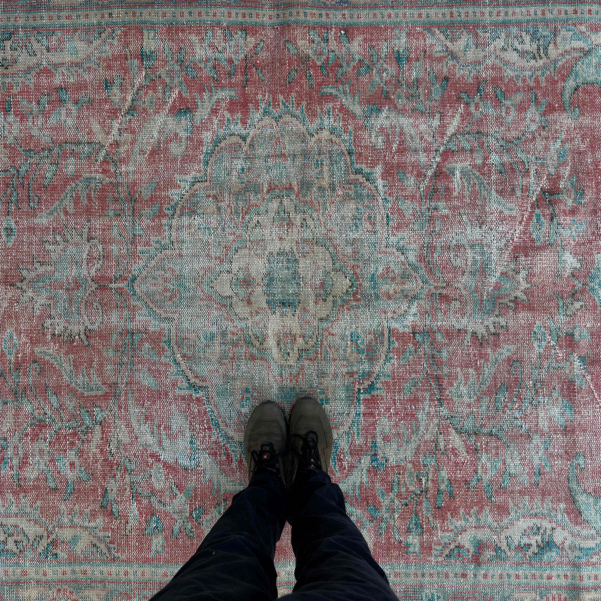 1970s red vintage turkish rug with medallion design, hand-knotted weave and low pile.