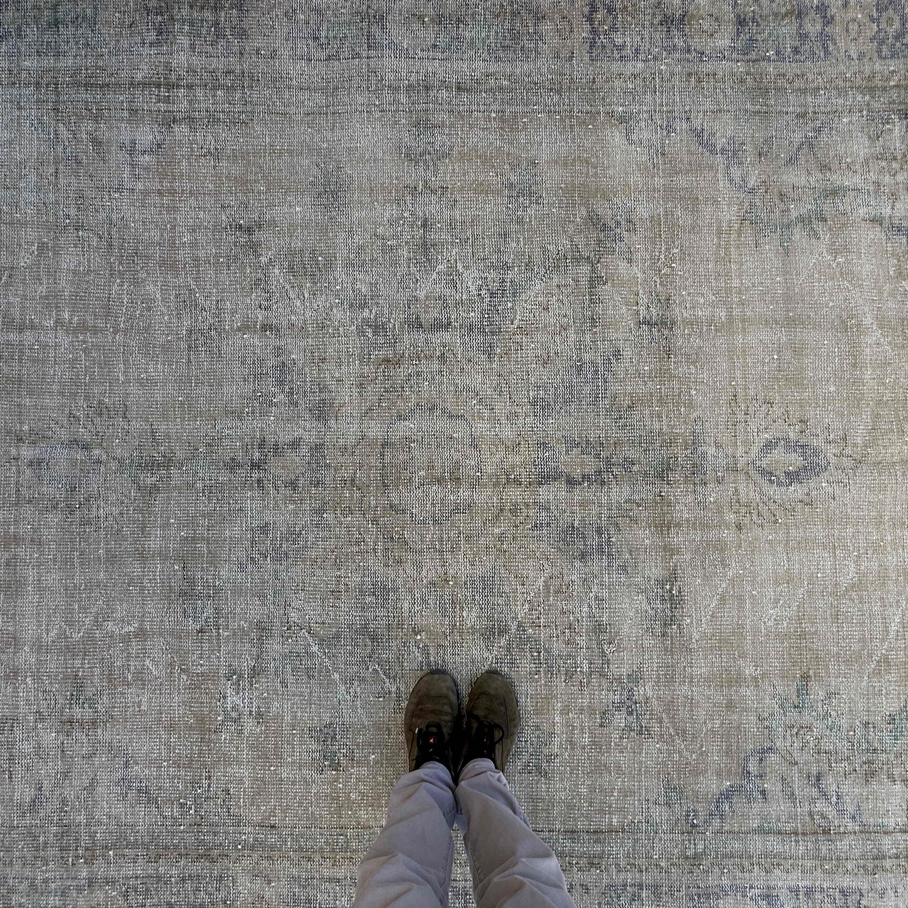 1970s beige vintage turkish rug with neutral design, hand-knotted weave and low pile.