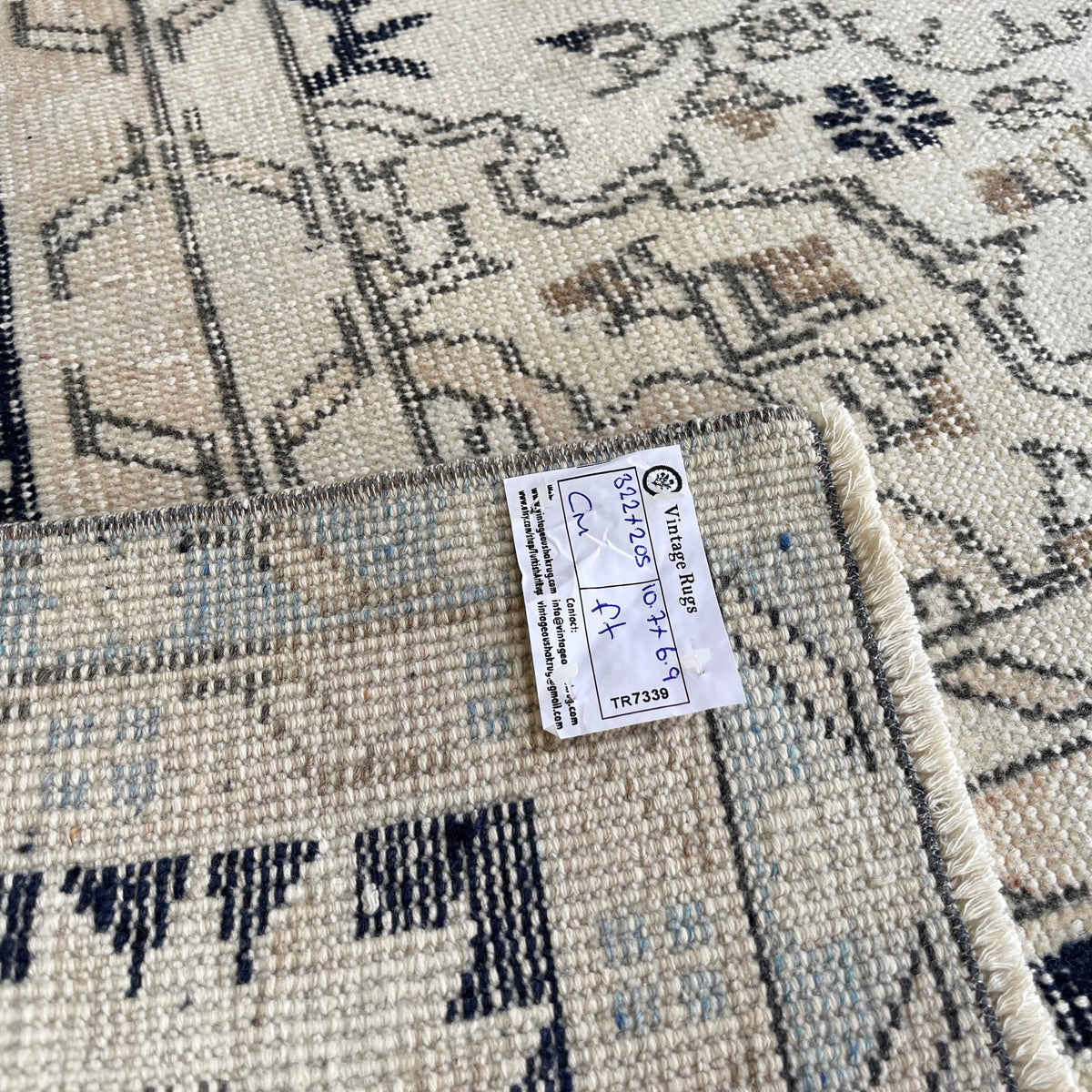 1970s blue vintage turkish rug with neutral design, hand-knotted weave and low pile.