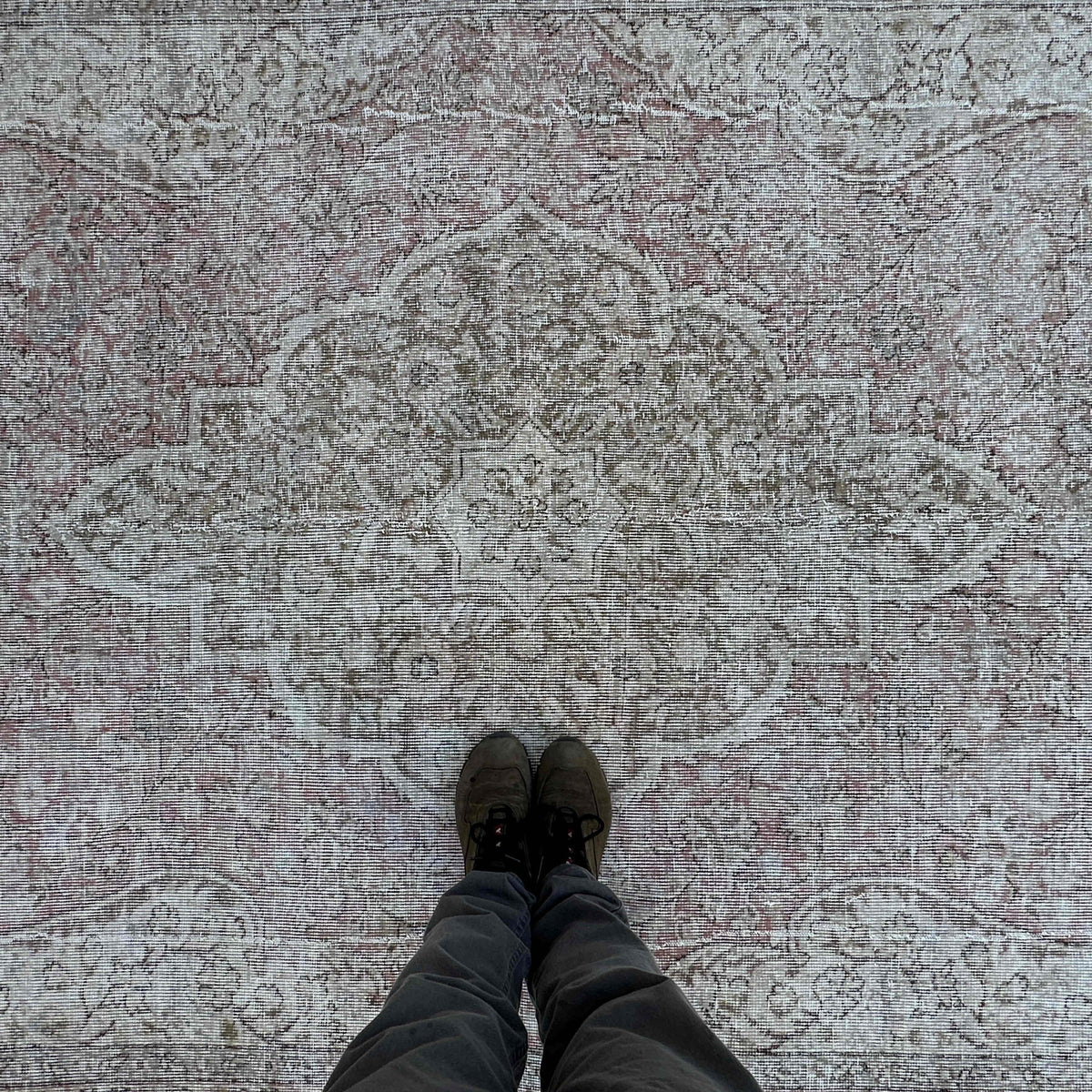 1970s pale red vintage turkish rug with neutral design, hand-knotted weave and low pile.