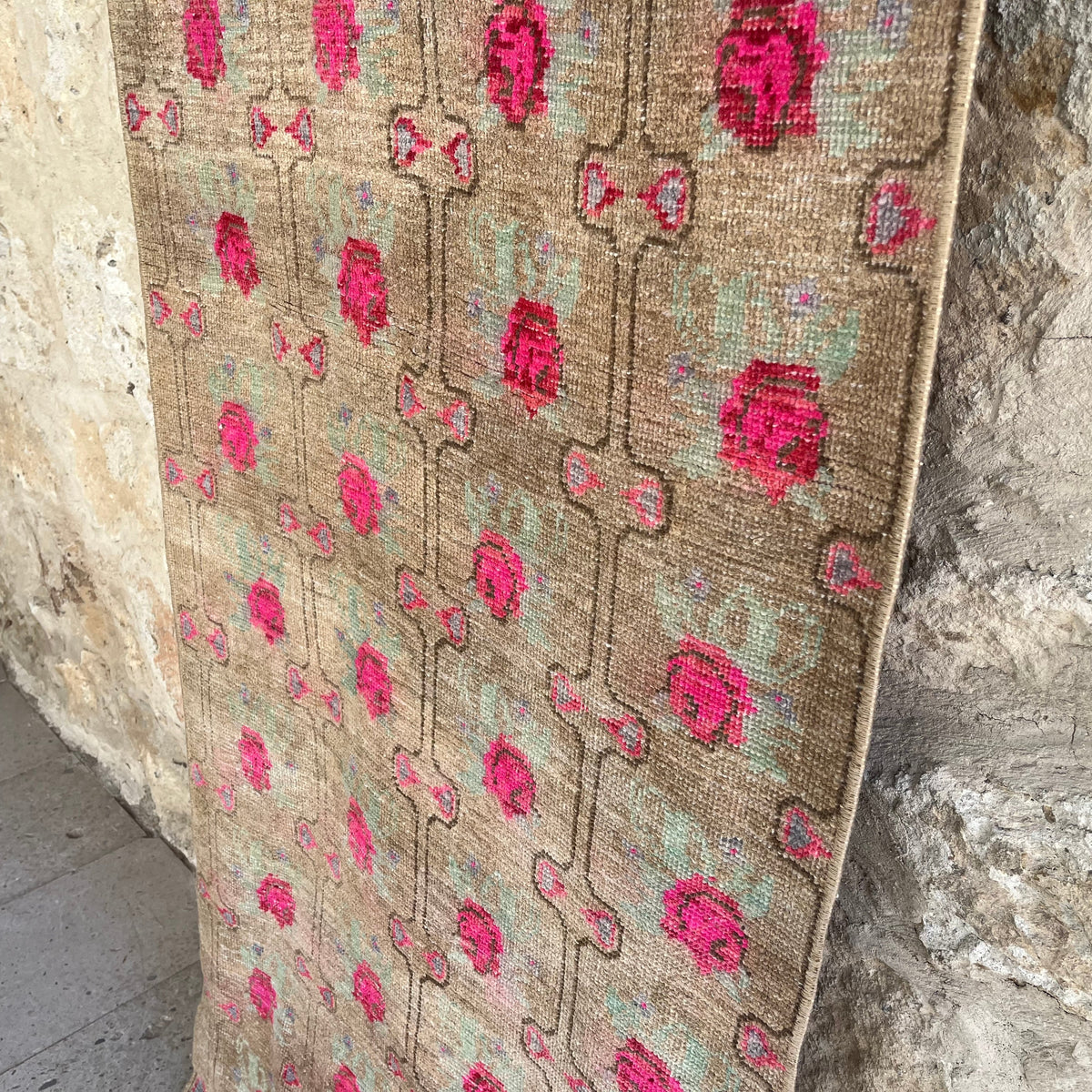 1970s brown vintage turkish runner rug with floral design, hand-knotted weave and low pile.