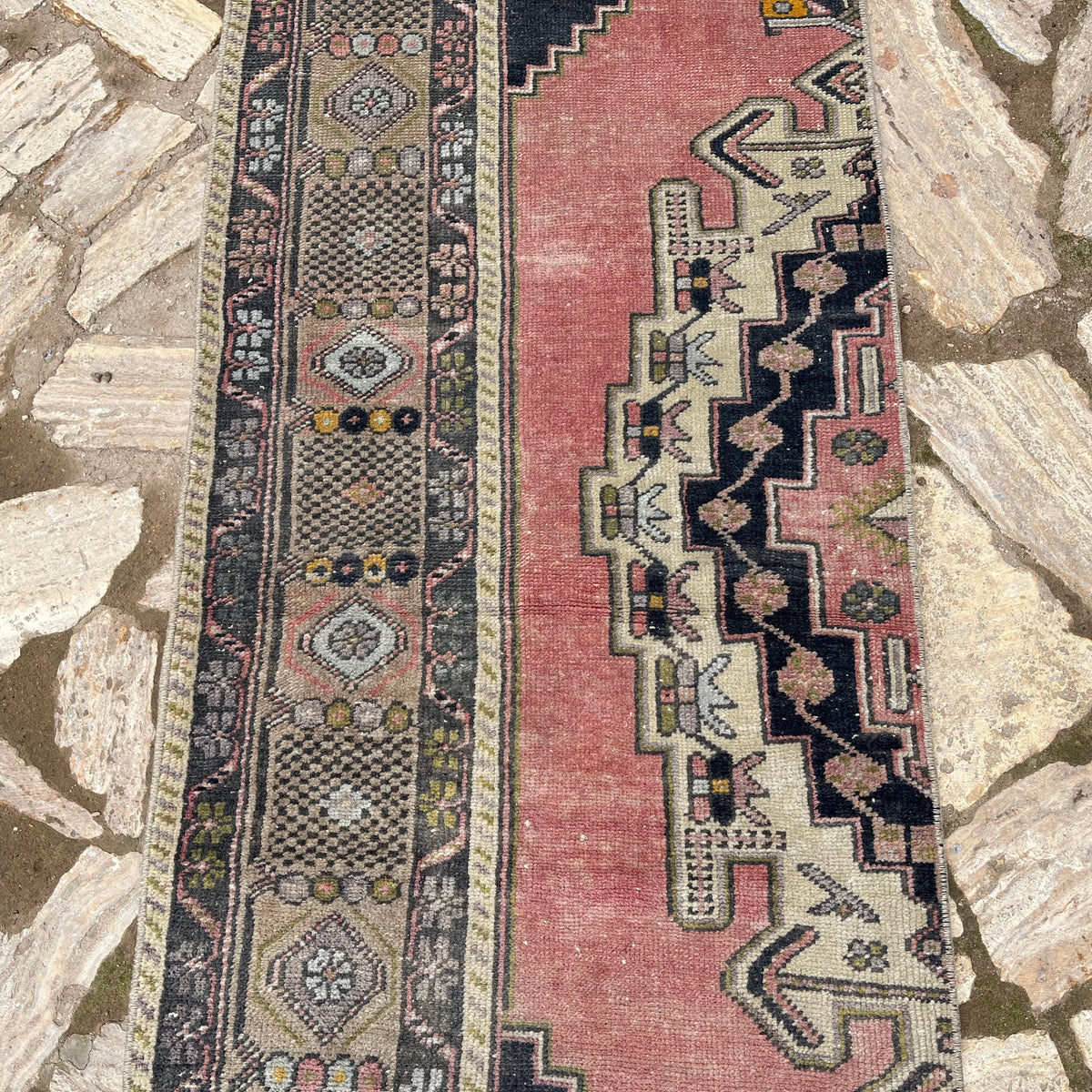 1970s pink vintage turkish runner rug with traditional design, hand-knotted weave and low pile.