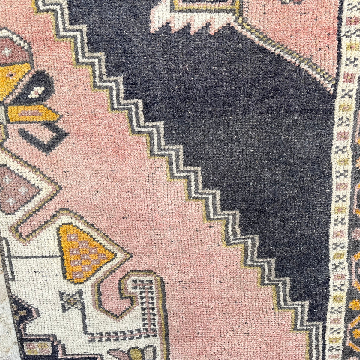 1970s pink vintage turkish runner rug with traditional design, hand-knotted weave and low pile.