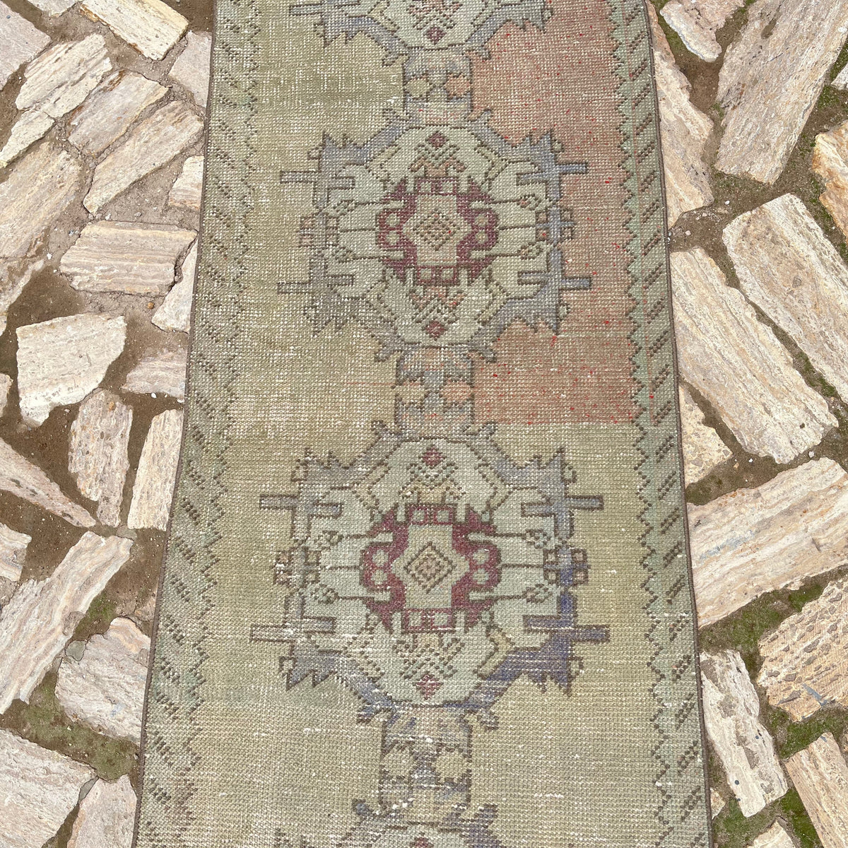 1970s beige vintage turkish runner rug with traditional design, hand-knotted weave and low pile.