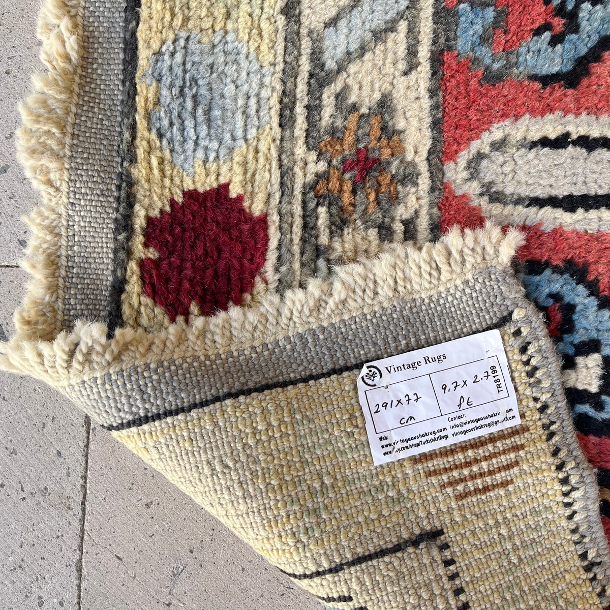 Close-up of the gray vintage turkish runner rug showing oushak details, hand-knotted weave, wool and cotton and low pile.