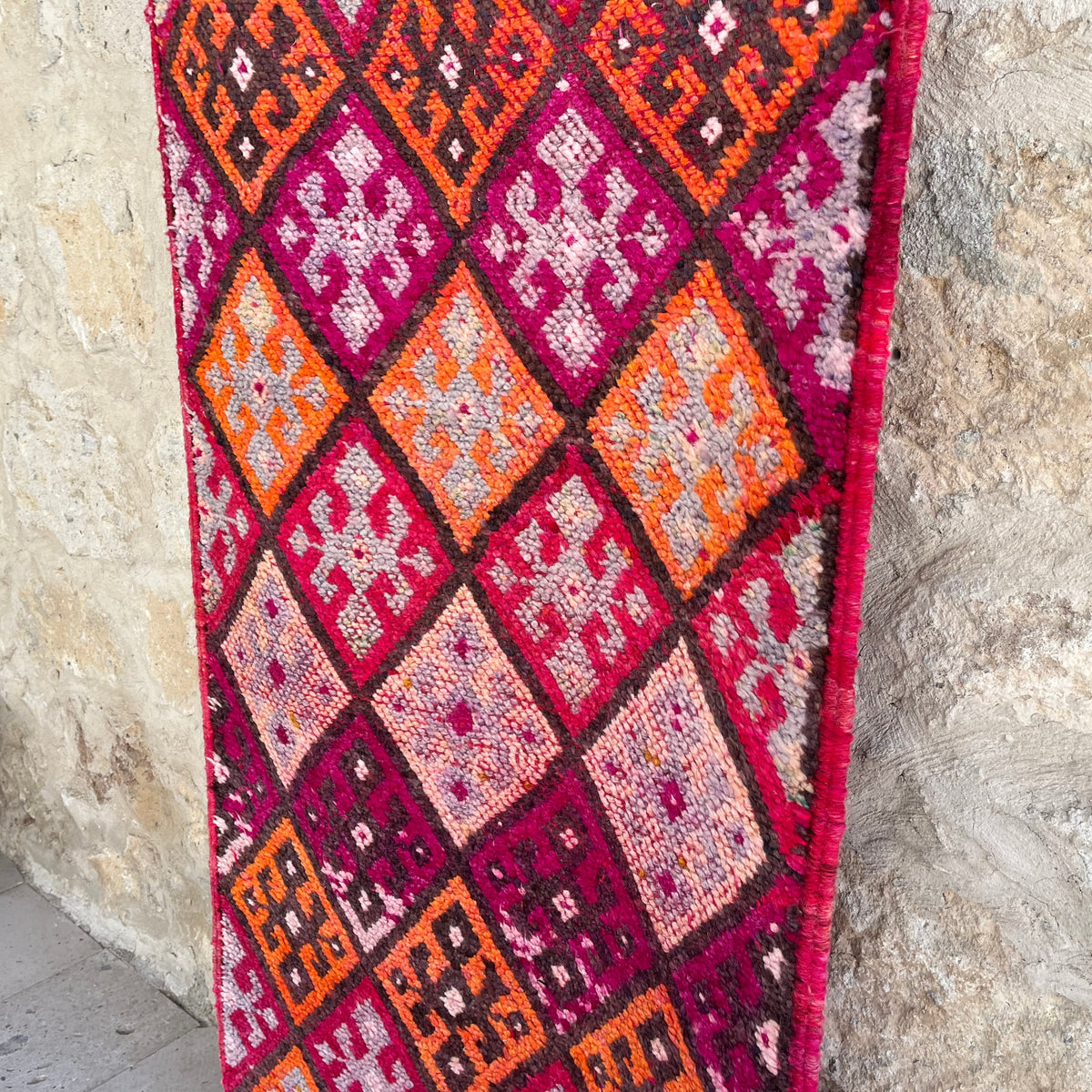 1970s pink vintage turkish runner rug with traditional design, hand-knotted weave and medium pile.