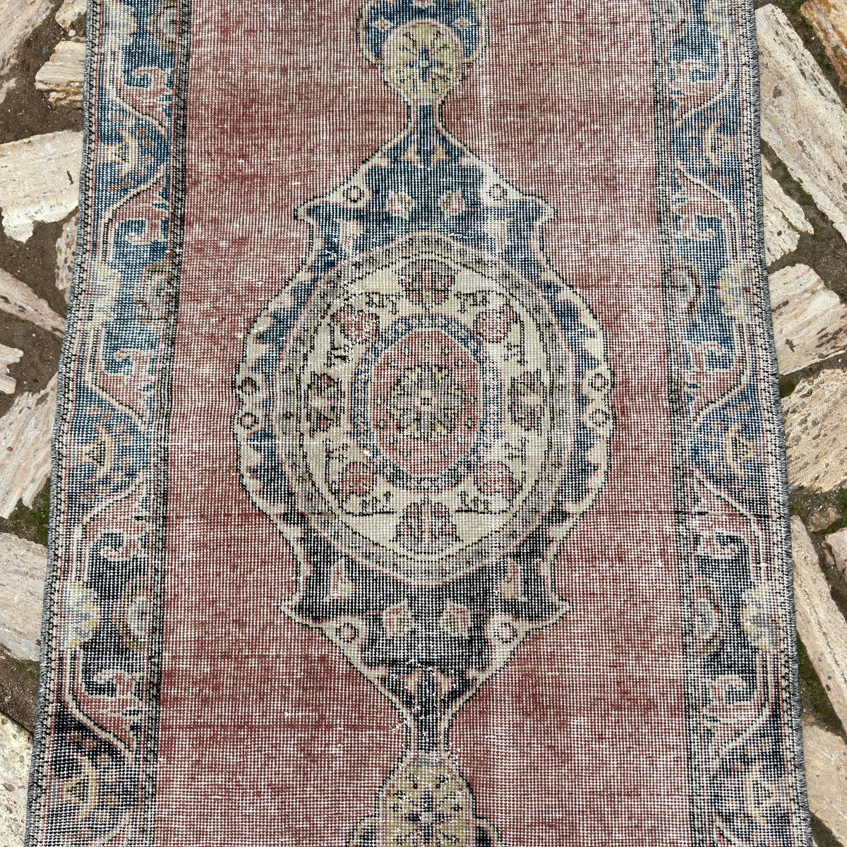 1970s red vintage turkish runner rug with traditional design, hand-knotted weave and low pile.