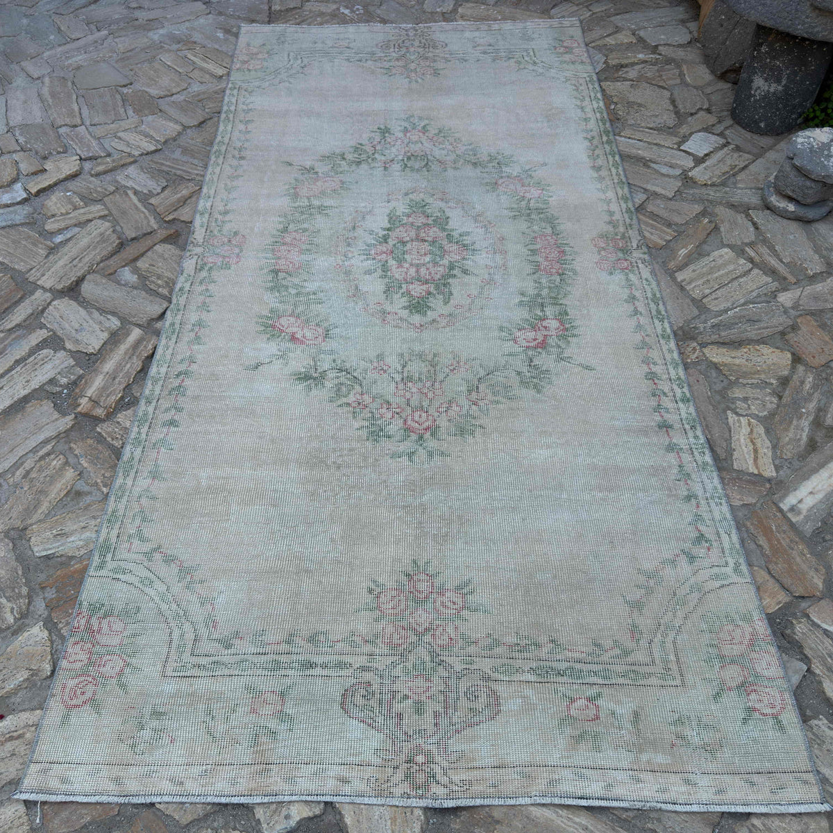 Beige 5' x 10' vintage turkish runner rug in wool and cotton, shown on the floor.