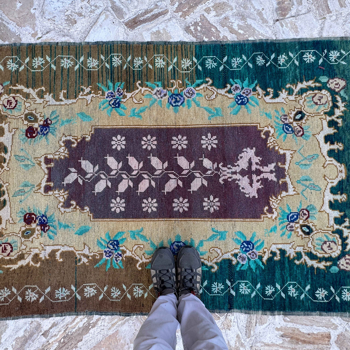 1970s pale green vintage Turkish wool carpet with traditional design, hand-knotted weave and low pile.