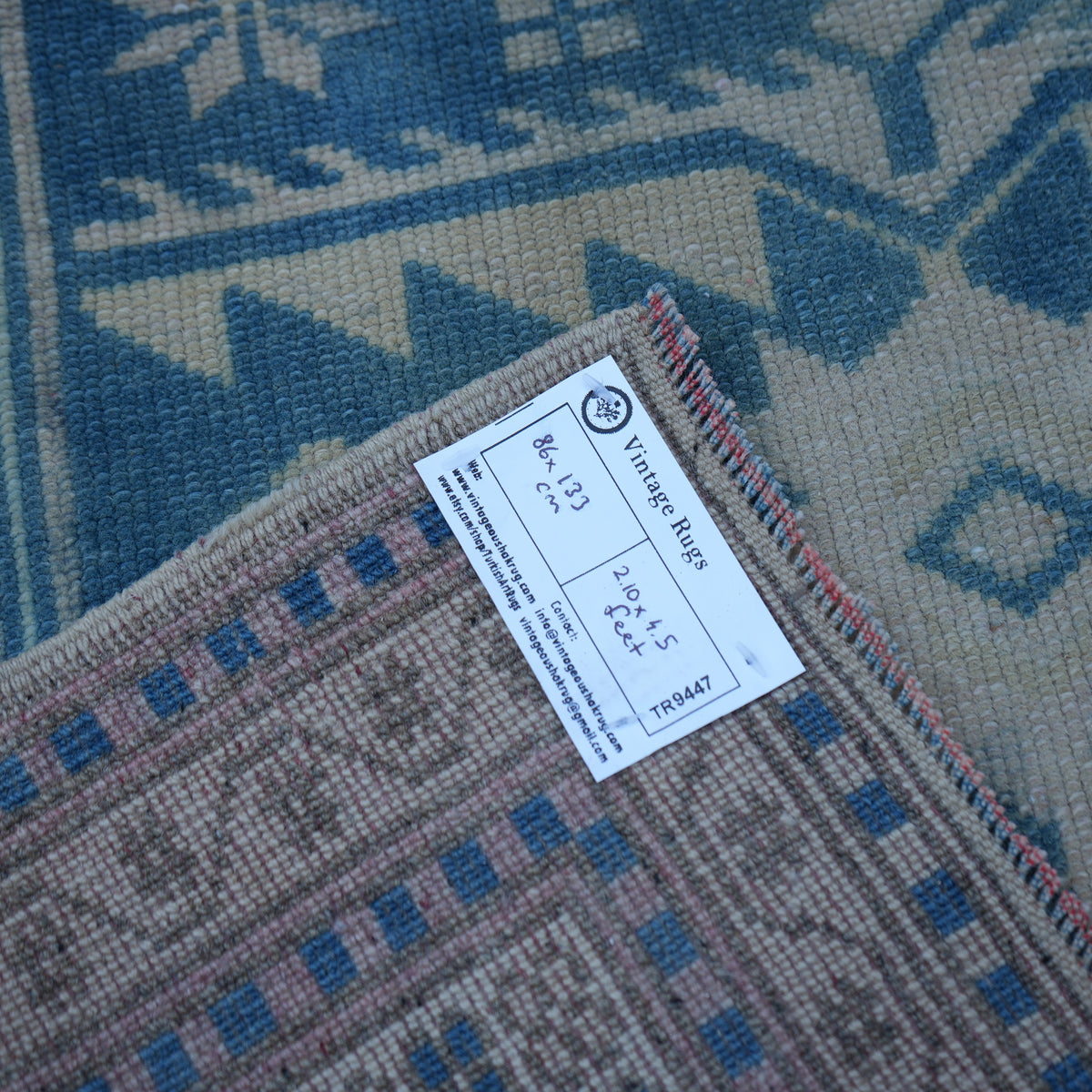 Blue 3' x 4' vintage Turkish wool rug from the 1970s with neutral design.