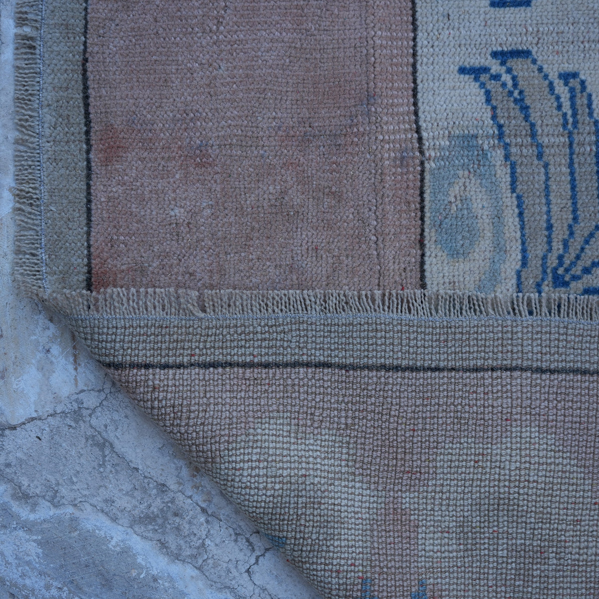 1970s pink vintage Turkish wool rug with geometric design, hand-knotted weave and low pile.