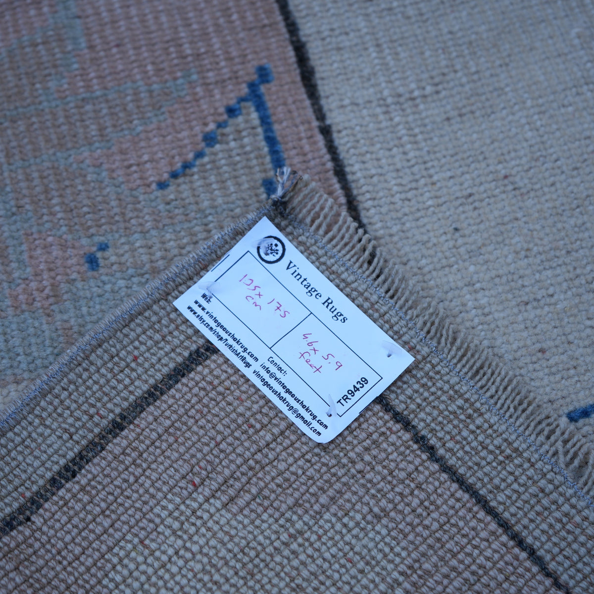 Pink 4' x 6' vintage Turkish wool rug from the 1970s with geometric design.