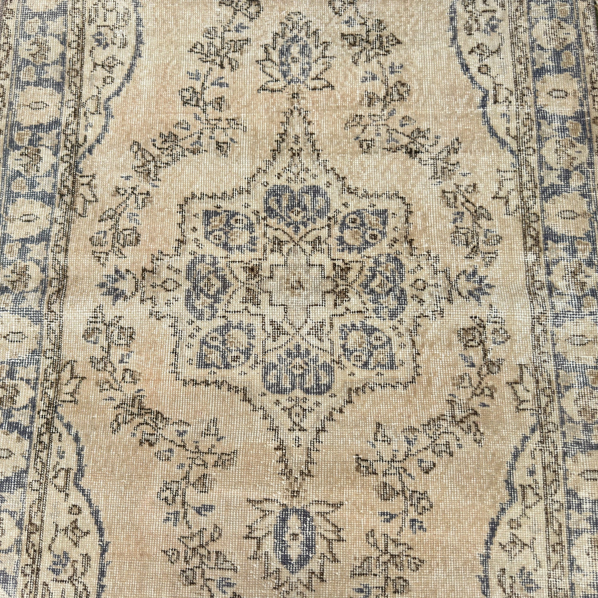 1970s blue vintage Turkish wool rug with medallion design, hand-knotted weave and low pile.