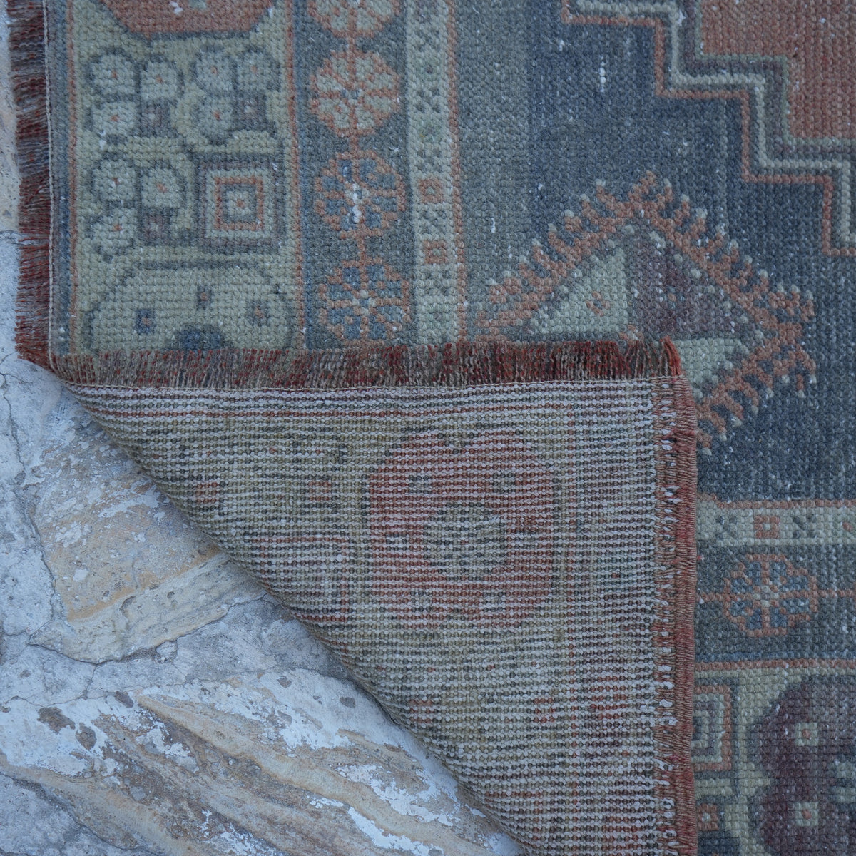 1970s orange vintage Turkish wool rug with traditional design, hand-knotted weave and low pile.