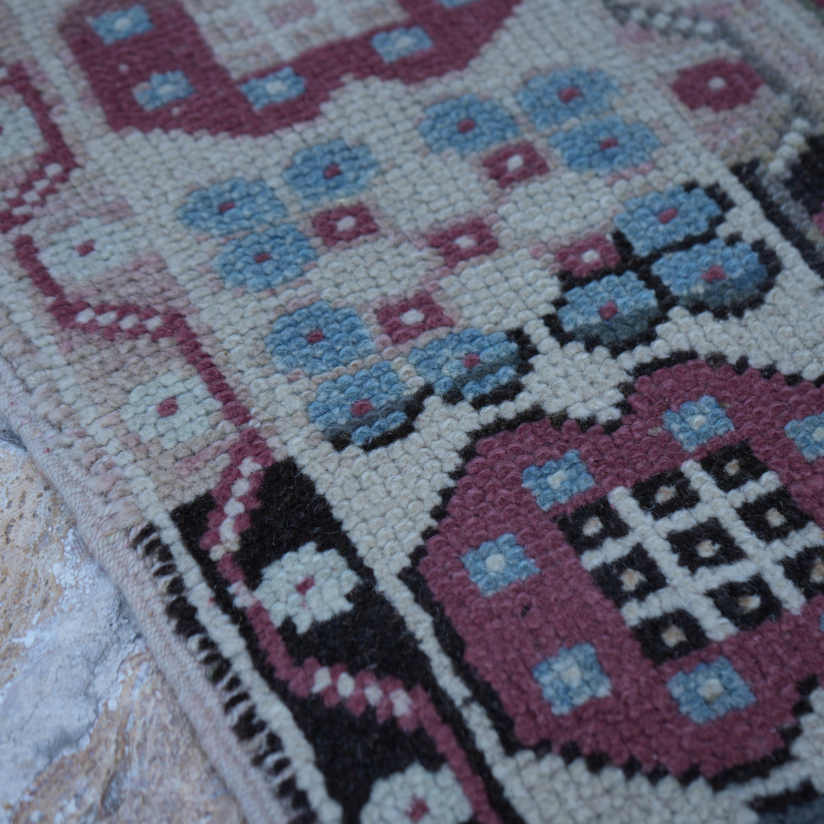 Pale Purple 4' x 7' vintage Turkish wool rug in wool, shown on the floor.