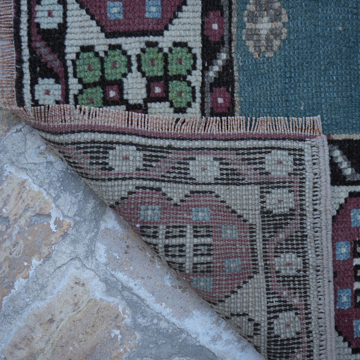 1970s pale purple vintage Turkish wool rug with traditional design, hand-knotted weave and low pile.