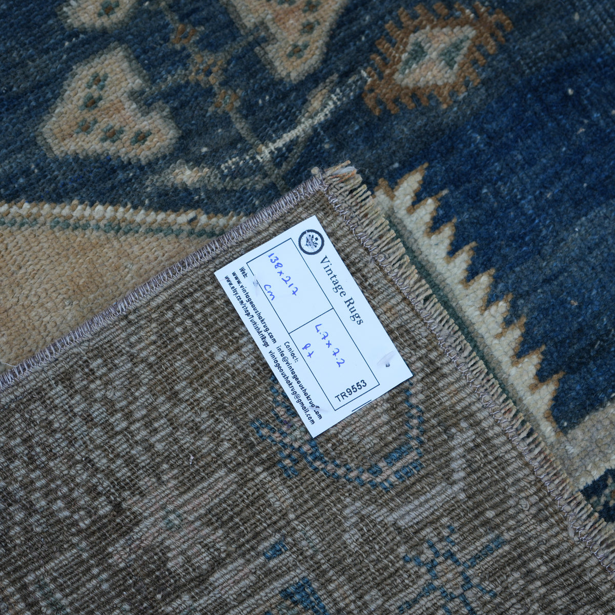 Blue 5' x 7' vintage Turkish wool rug from the 1970s with neutral design.