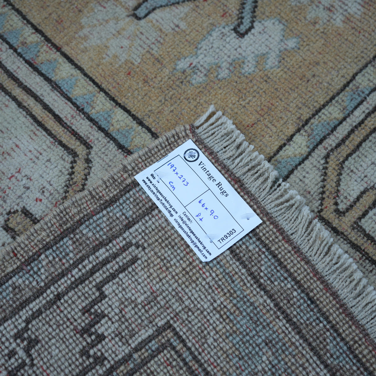 Beige 6' x 9' vintage Turkish wool rug from the 1970s with neutral design.
