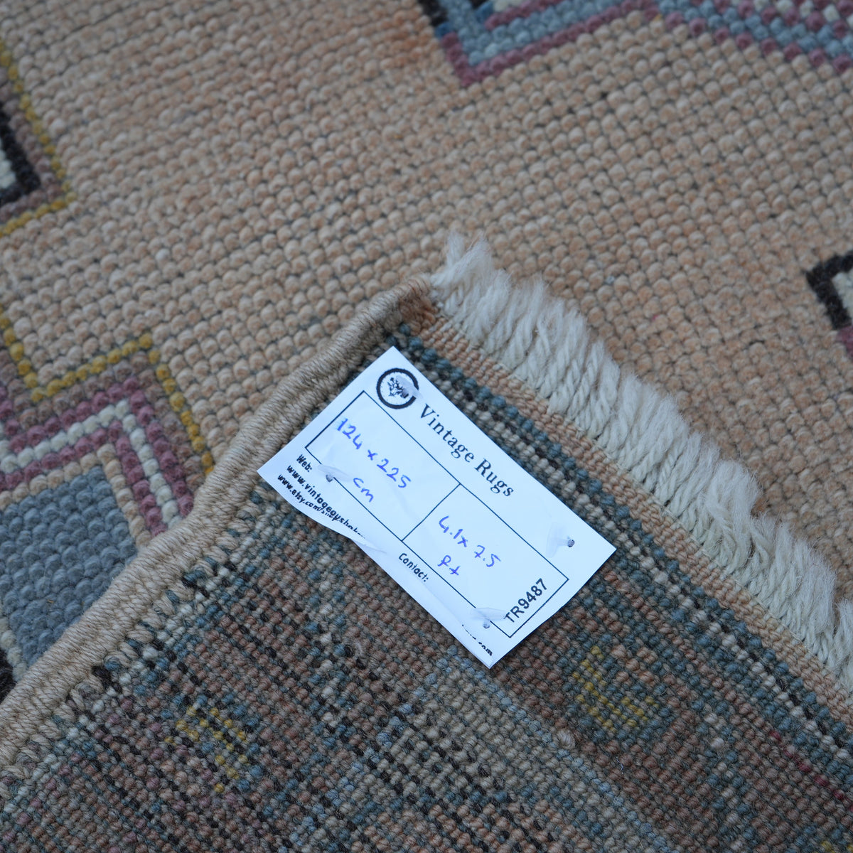 Blue 4' x 7' Turkish wool vintage rug from the 1970s with geometric design.