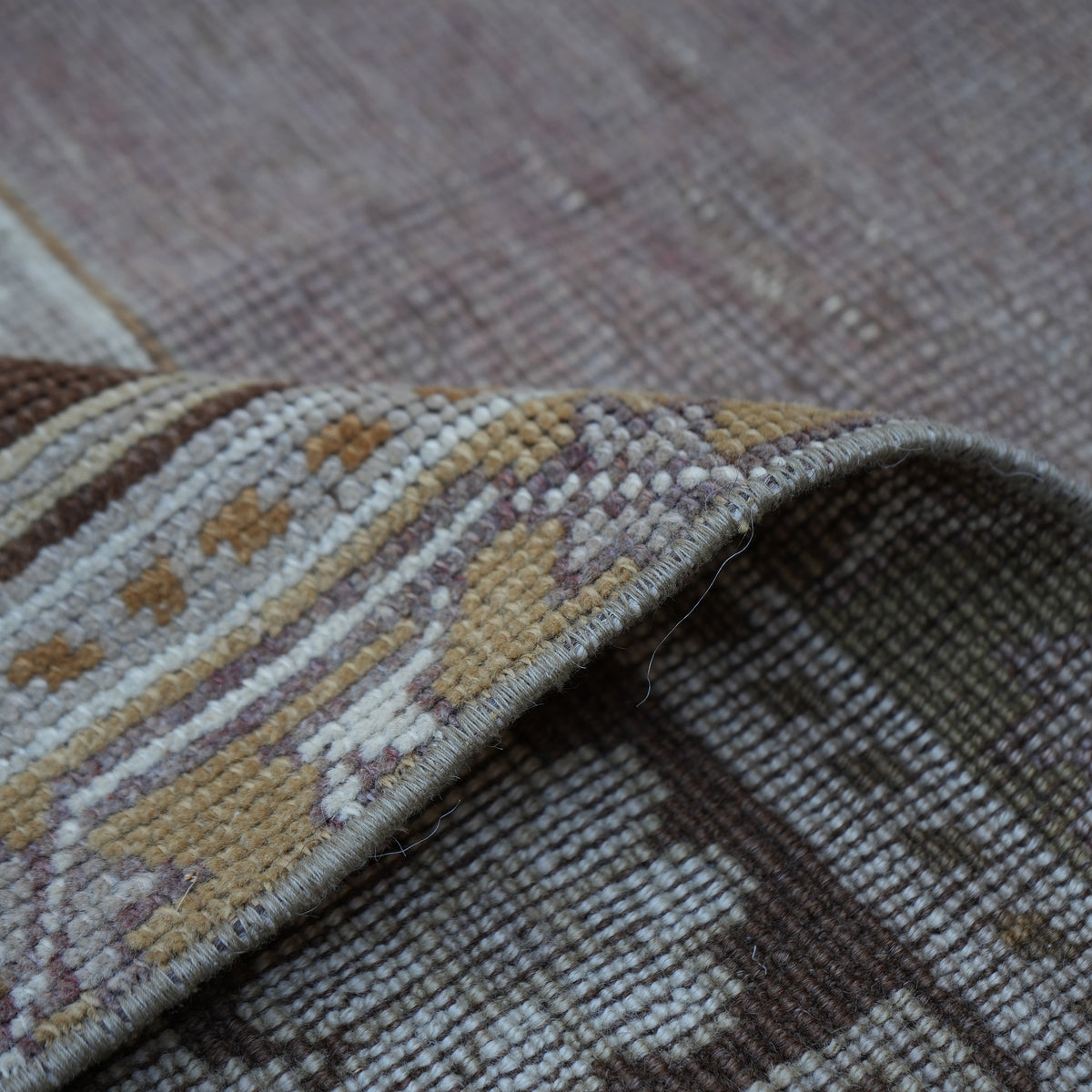 Additional view of the warm brown Turkish wool vintage rug, hand-knotted in wool.