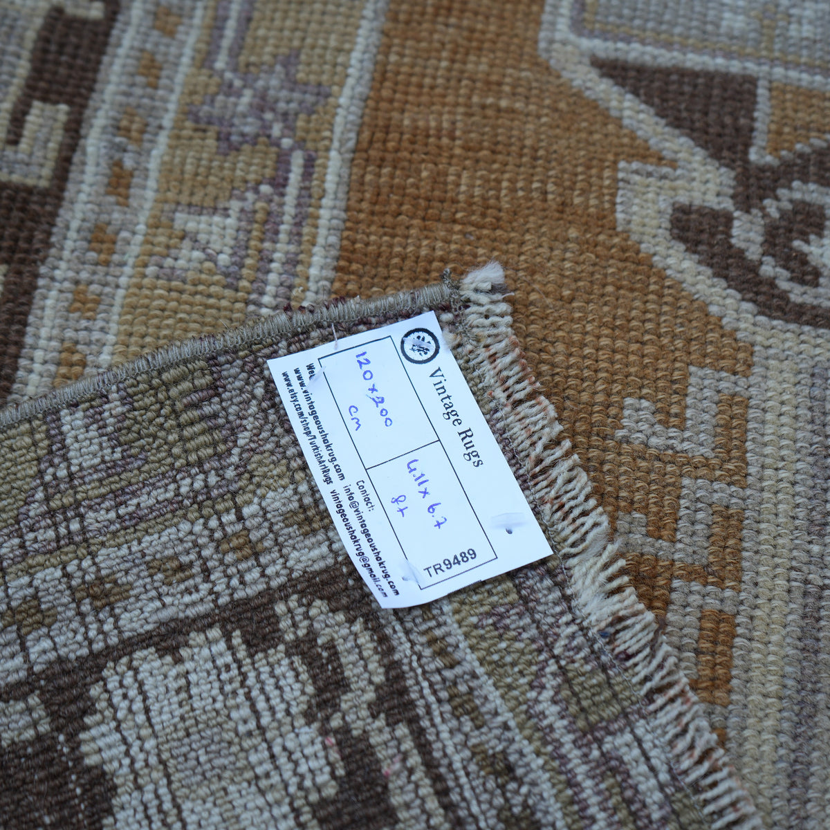 Warm Brown 4' x 7' Turkish wool vintage rug from the 1970s with neutral design.