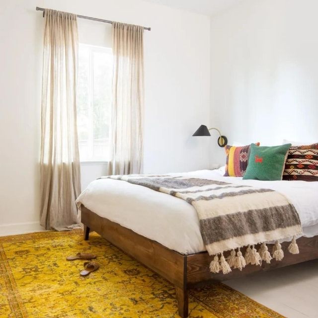Vintage rugs styled in a bedroom
