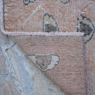 1970s pale orange Turkish art decor rug with traditional design, hand-knotted weave and low pile.
