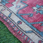 Red 2' x 4' Turkish authentic vintage rug in wool and cotton, shown on the floor.