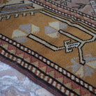 Orange 3' x 4' Turkish authentic vintage rug in wool, shown on the floor.