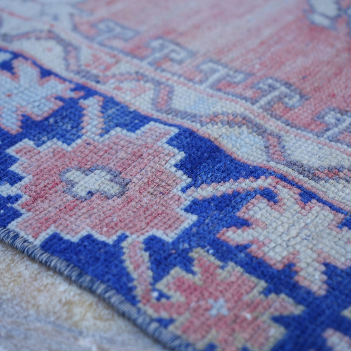 Blue 4' x 6' Turkish authentic vintage rug in wool, shown on the floor.