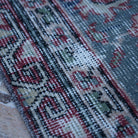 Blue 4' x 7' Turkish authentic vintage rug in wool and cotton, shown on the floor.