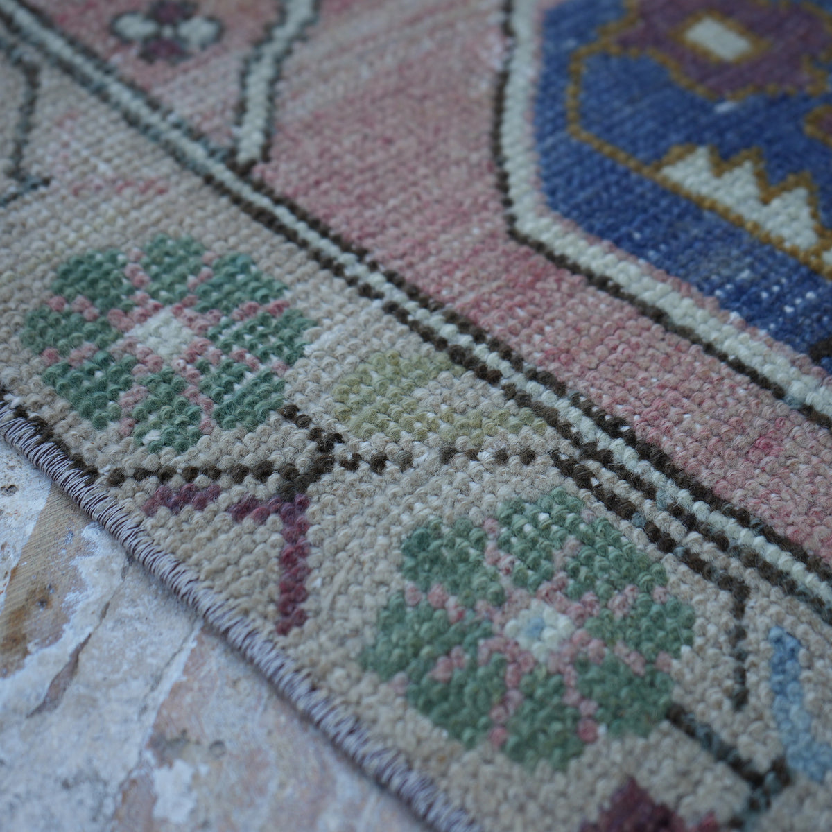 Pink 4' x 7' Turkish authentic vintage rug in wool and cotton, shown on the floor.