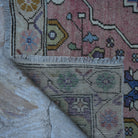 1970s pink Turkish authentic vintage rug with traditional design, hand-knotted weave and low pile.