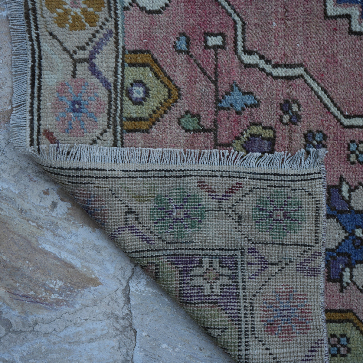 1970s pink Turkish authentic vintage rug with traditional design, hand-knotted weave and low pile.